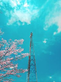 Low angle view of communications tower against sky