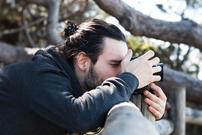 Portrait of young man relaxing outdoors