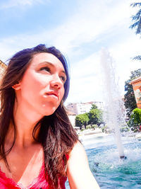 Portrait of young woman in swimming pool