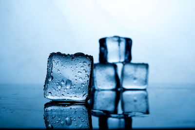 Close-up of ice cubes on table