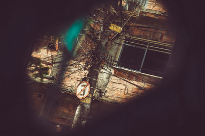 Illuminated building seen through window
