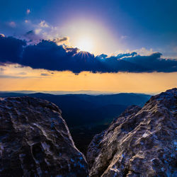 Scenic view of mountains against sky during sunset