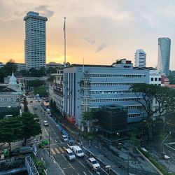 High angle view of city street and buildings against sky