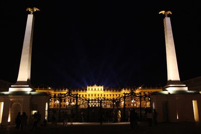 Group of people in illuminated building at night