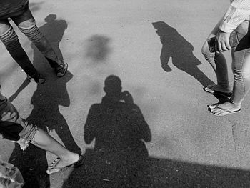 Black and white shadow of people and family walking in the morning 