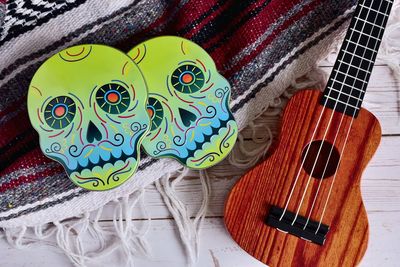 High angle view of guitar on bed