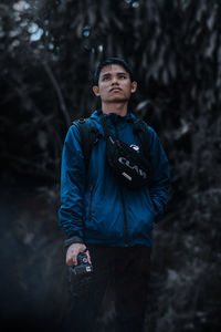 Portrait of young man looking away