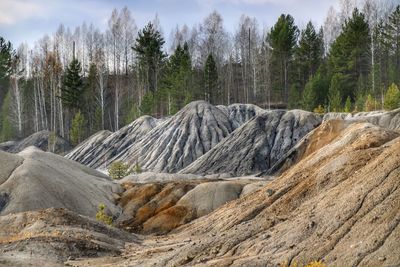 Panoramic shot of rocks on land against sky