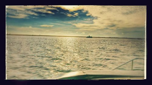 Scenic view of sea against sky at sunset