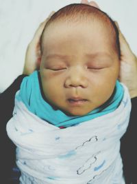 Close-up portrait of cute baby sleeping