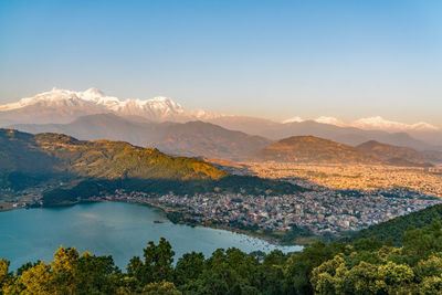 Scenic view of mountains against blue sky