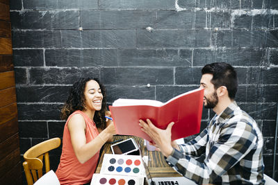 Business people discussing at desk in office