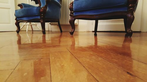 Empty chairs on hardwood floor