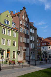 Residential buildings against blue sky
