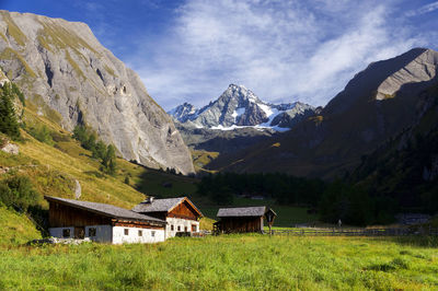 Scenic view of mountains against cloudy sky