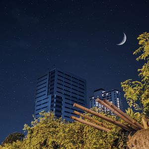 Low angle view of building against sky at night