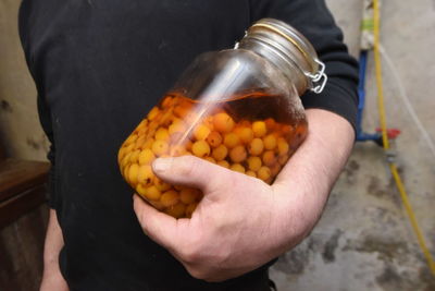 Close-up of man preparing food