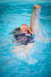 Man swimming in pool