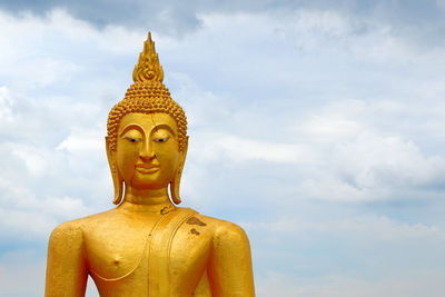 Low angle view of statue against sky