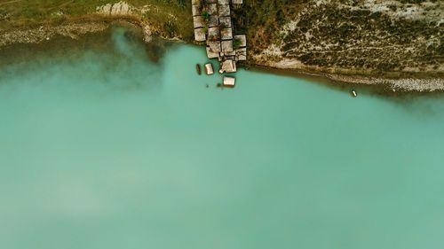 High angle view of lake amidst rocks