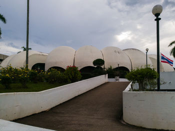 View of empty road against cloudy sky