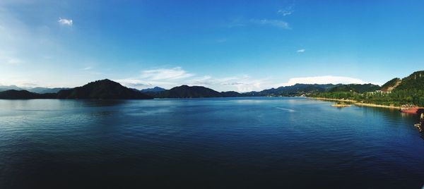 Scenic view of lake against blue sky