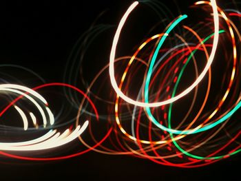 Close-up of light painting against black background