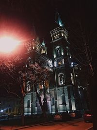 Low angle view of illuminated buildings at night