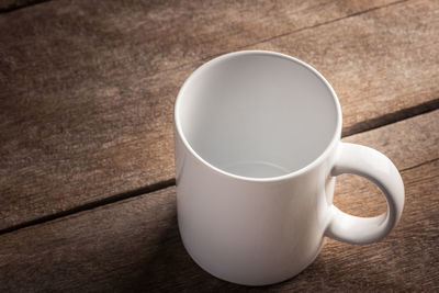 High angle view of coffee cup on table