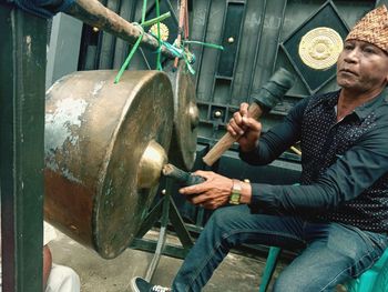 Side view of a man working in container