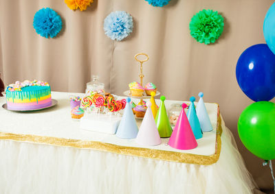 Multi colored cake on table