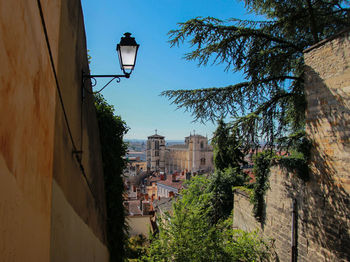 Low angle view of street light against clear blue sky