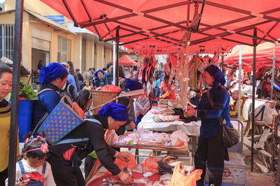 People at market stall