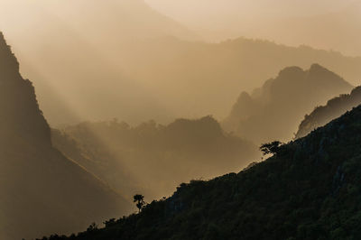 Scenic view of mountains against sky during sunset