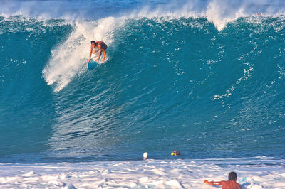 People swimming in sea