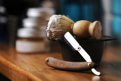 Set of shaving equipment and men's cosmetic products on wooden table, barbershop. shave concept 