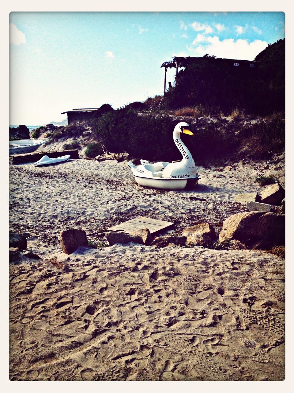 transfer print, auto post production filter, beach, sky, sea, transportation, water, sand, nautical vessel, shore, rock - object, moored, tranquility, mode of transport, sunlight, boat, tranquil scene, nature, day, outdoors