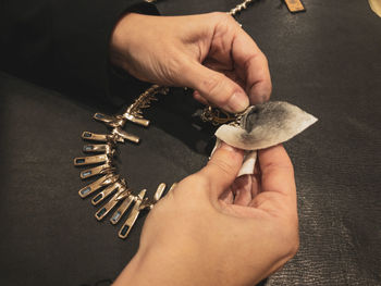 Cropped hand of person holding coins