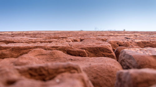 Scenic view of desert against clear sky