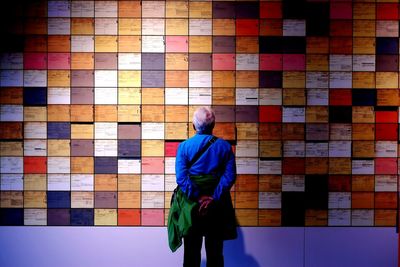 Woman standing against wall