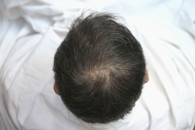 High angle view of man sitting at barber shop