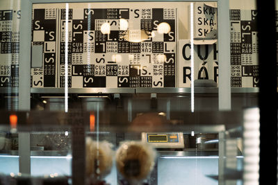 Reflection of illuminated text on glass