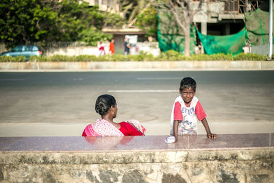 Girl playing with arms raised