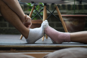 Close-up of touching feet