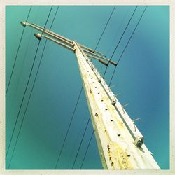 Low angle view of tree against blue sky