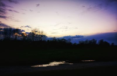 Scenic view of silhouette landscape against sky at sunset