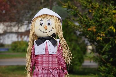 Low angle view of human likeness fall decoration against blurred background