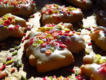 High angle view of unicorn shaped cookie with sprinkles