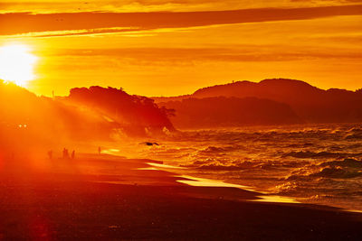 Scenic view of sea against sky during sunrise