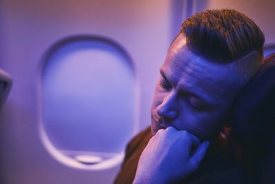 Man sleeping in airplane